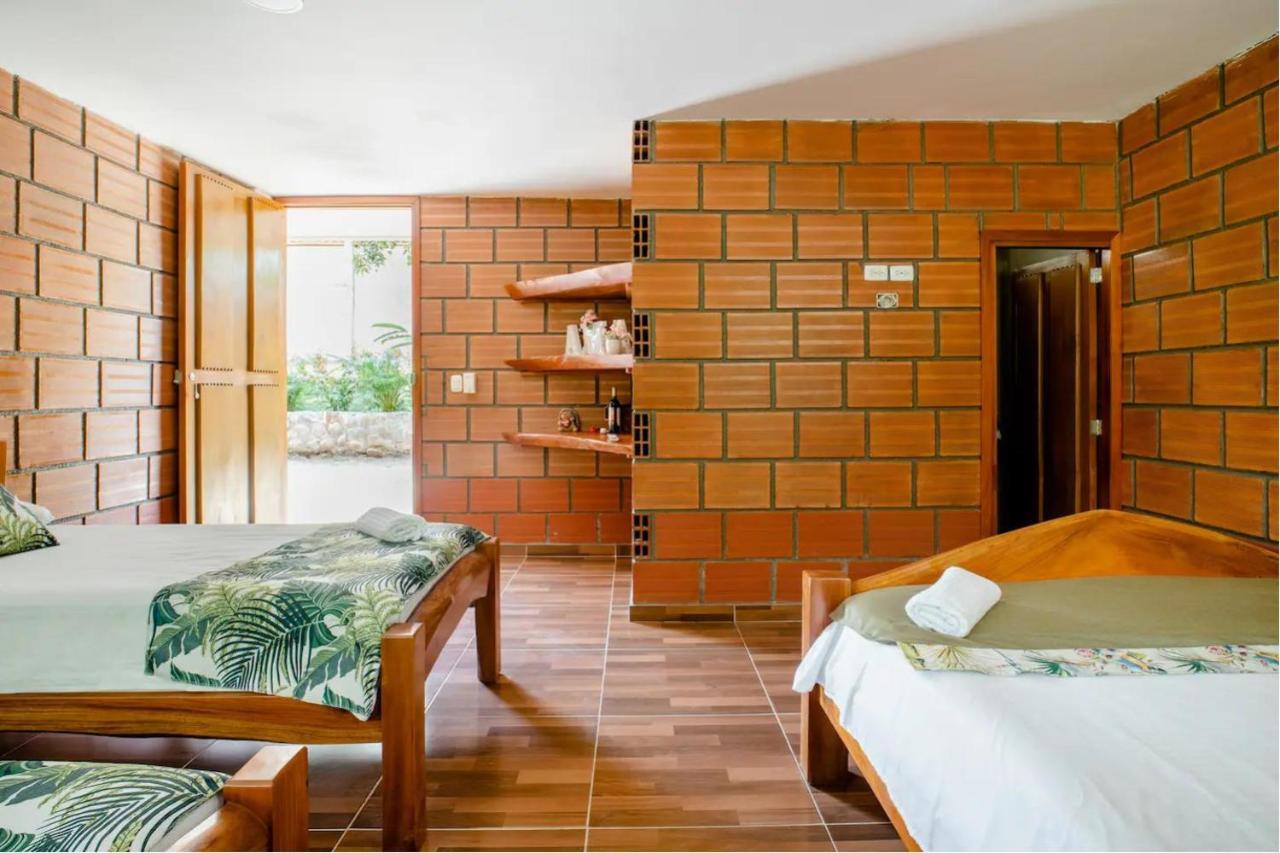 Arca Tayrona Restaurant & Hostal 洛斯纳兰霍斯 外观 照片